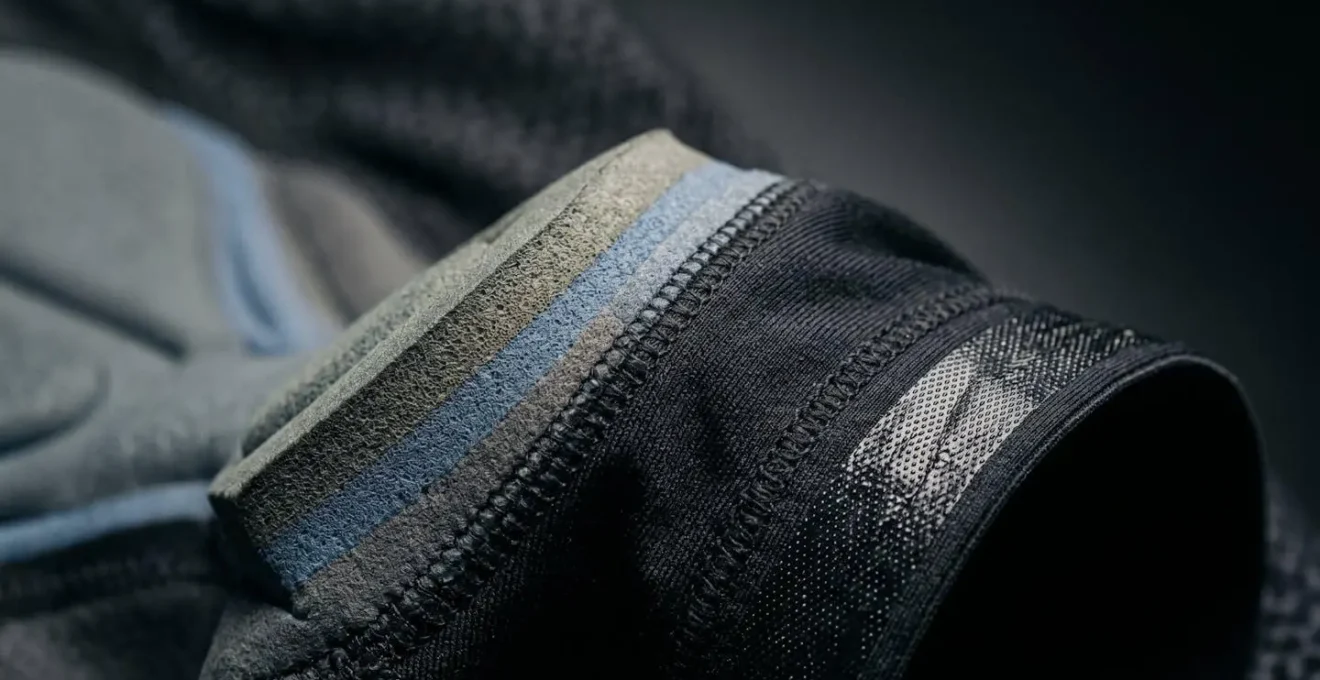Close-up view of high-quality cycling bib shorts highlighting advanced chamois padding technology and compression fabric